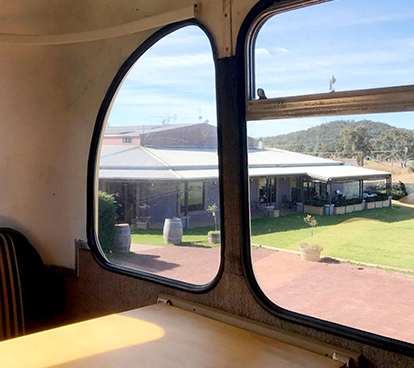 Jester Hill Wines through the window of a vintage bus.