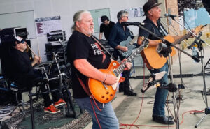 No Relation Duo band on stage playing and singing